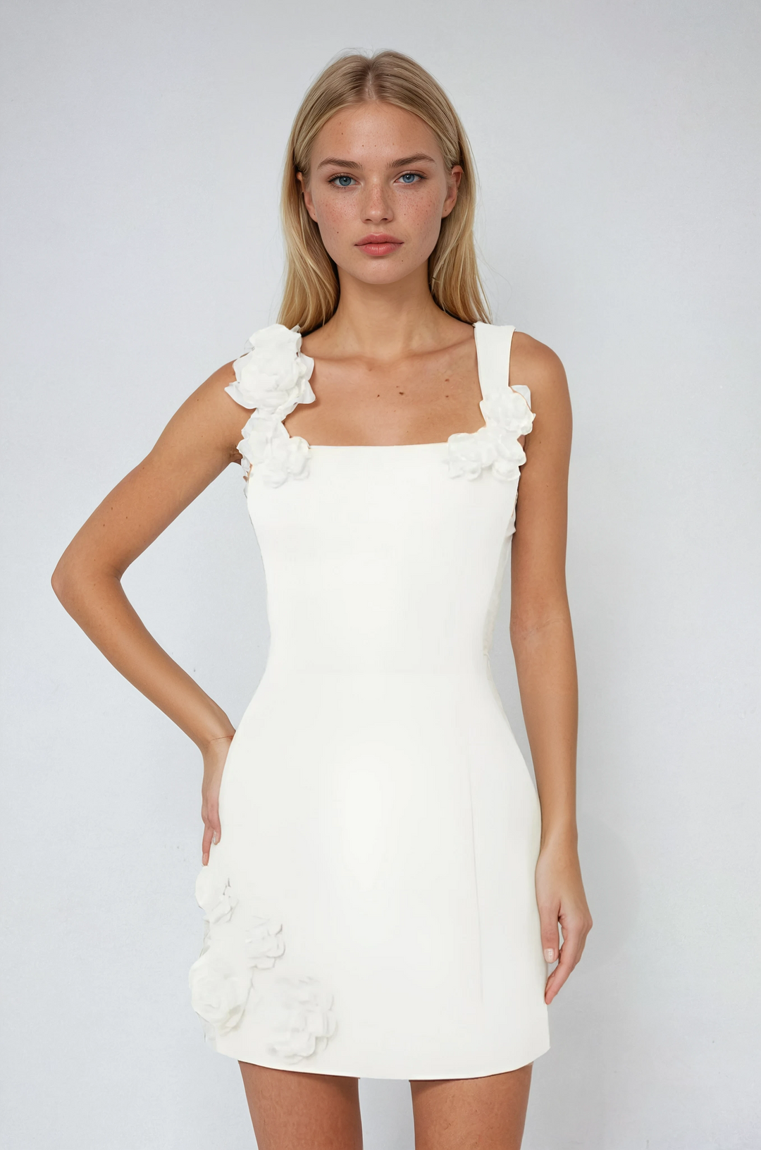 Vibrant women's pink floral appliqué mini dress, perfect for a sunny summer day or evening party.