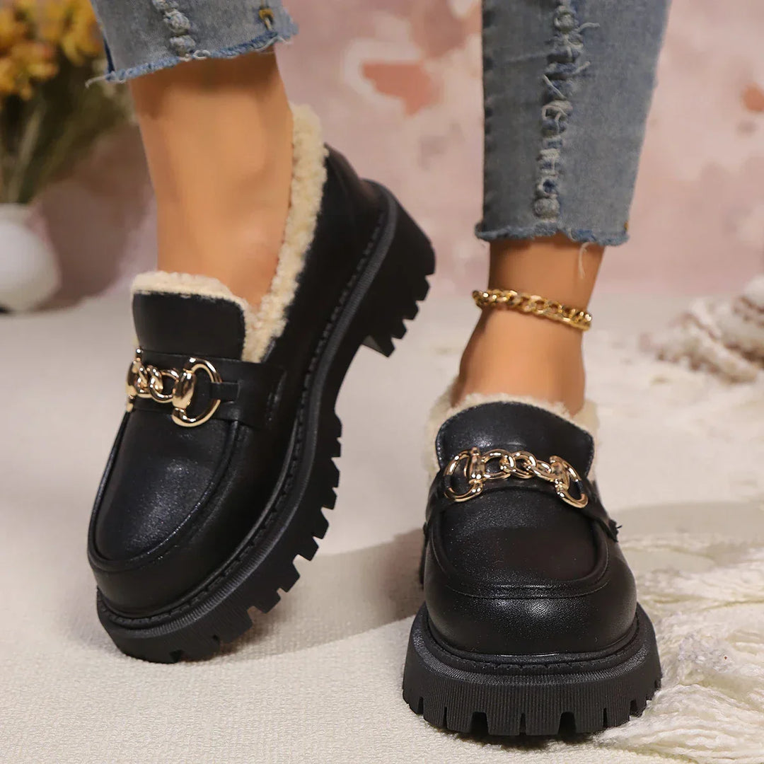 Fashionable women's slip-on loafers, featuring a bold chunky platform sole for a modern look.