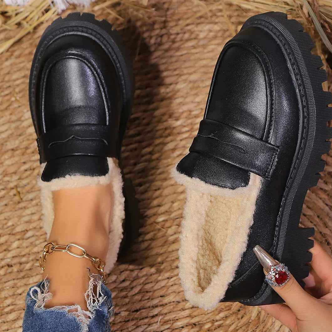 Classic women's platform loafers with a chunky sole, offering bold design & easy slip-on wear.