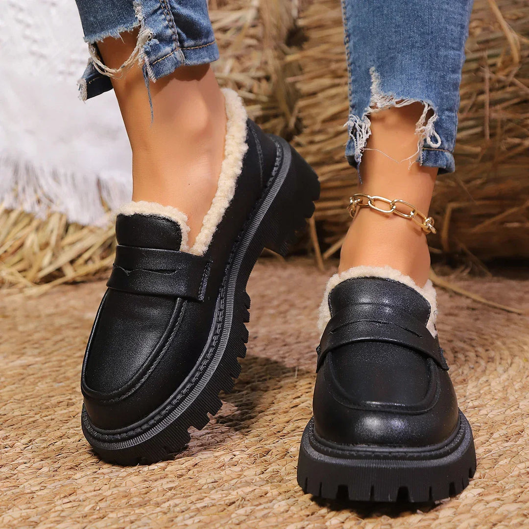 Bold women's platform loafers, chunky sole, slip-on comfort, perfect for statement casual footwear.