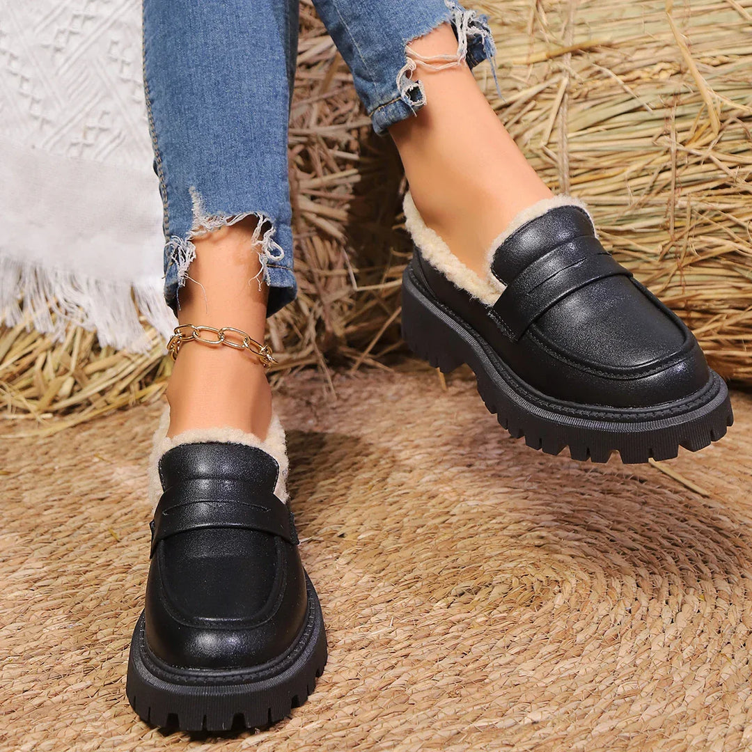 Stylish women's platform loafers, slip-on, with a chunky sole for modern casual fashion footwear.