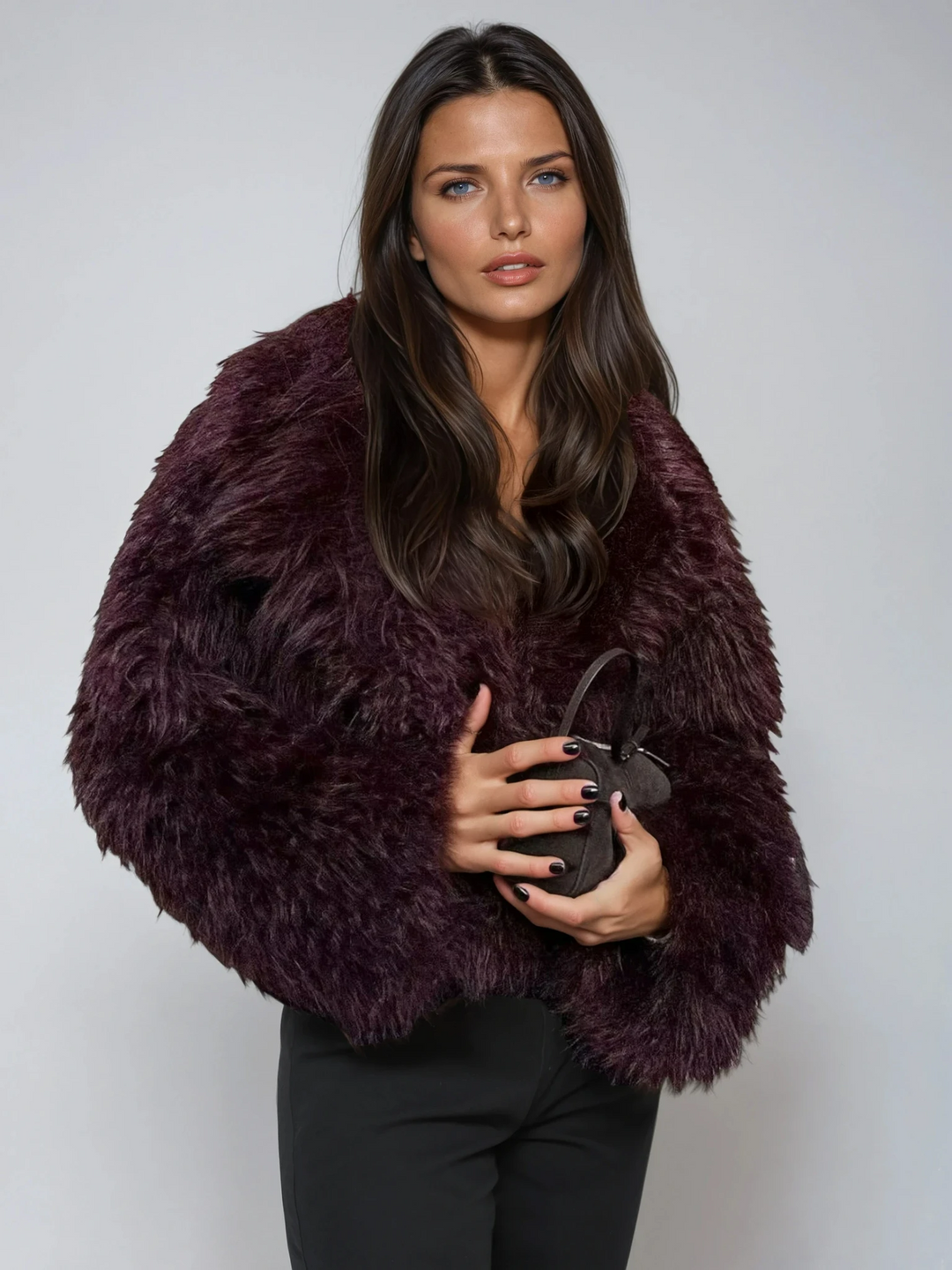 Women's plush cropped burgundy jacket, a chic statement outerwear piece perfect for winter fashion and evening style.