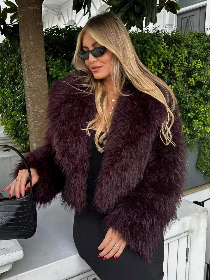 Plush cropped statement jacket for women, a luxurious and fashionable outerwear piece for winter elegance.