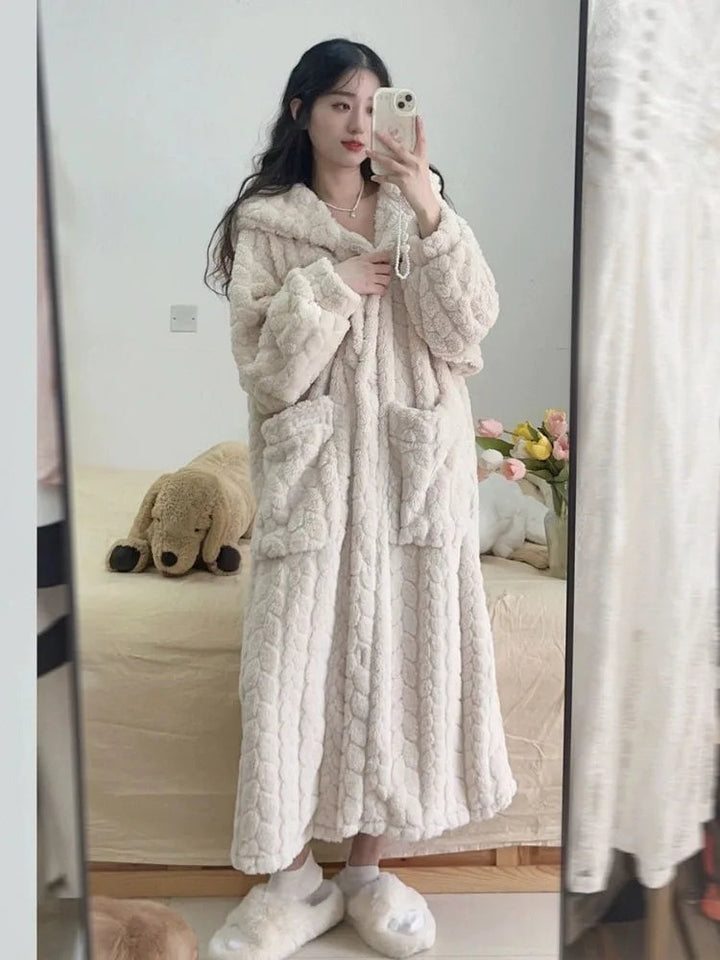 Cozy women's hooded plush bathrobe, ideal for warm winter relaxation & home wear. Soft loungewear gift.