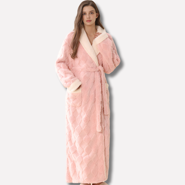 Women's plush hooded flannel bathrobe, perfect for warm winter loungewear. Soft coral fleece long robe for cozy comfort.
