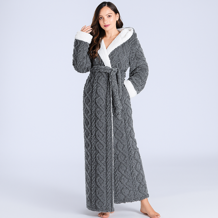 Soft women's plush hooded bathrobe in cozy flannel. Ideal for warm winter sleepwear & relaxation. Long coral fleece robe.