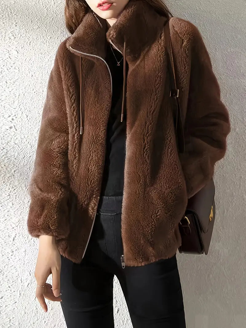 Warm women's teddy winter jacket. Plush fabric, practical drawstring & zipper for versatile fall fashion.