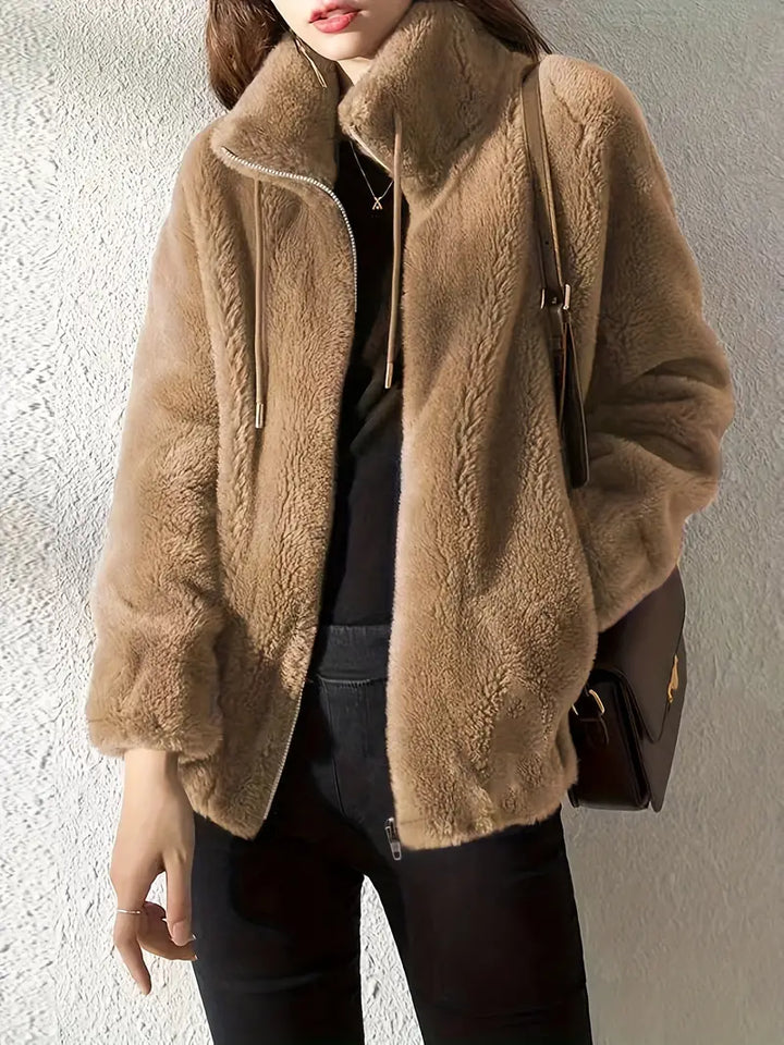 Comfortable ladies plush teddy coat with front zipper, drawstring hem, ideal for cozy autumn outfits.
