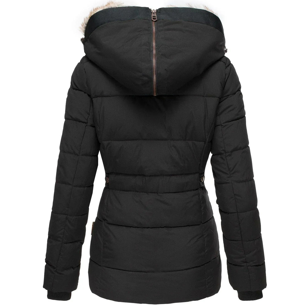 Warm women's puffer coat for winter. Plush, quilted design, ideal for cold weather fashion.
