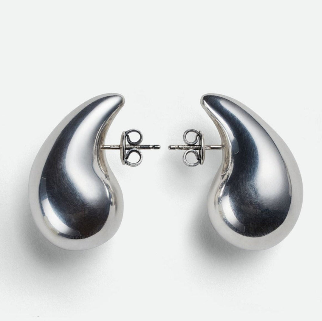 Refined silver polished teardrop dangle earrings. Modern women's jewelry for everyday elegance.