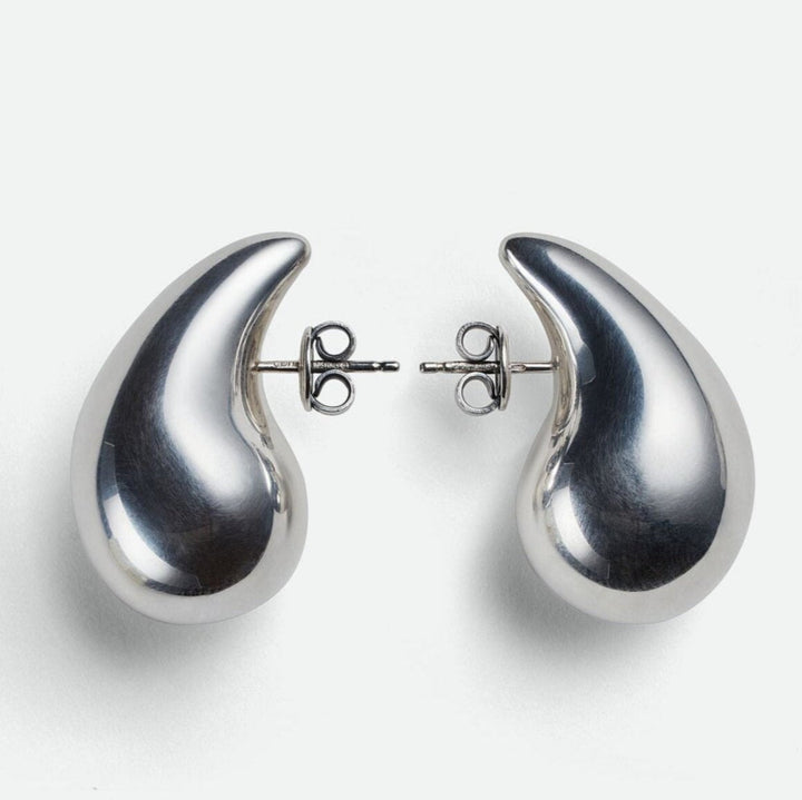 Refined silver polished teardrop dangle earrings. Modern women's jewelry for everyday elegance.