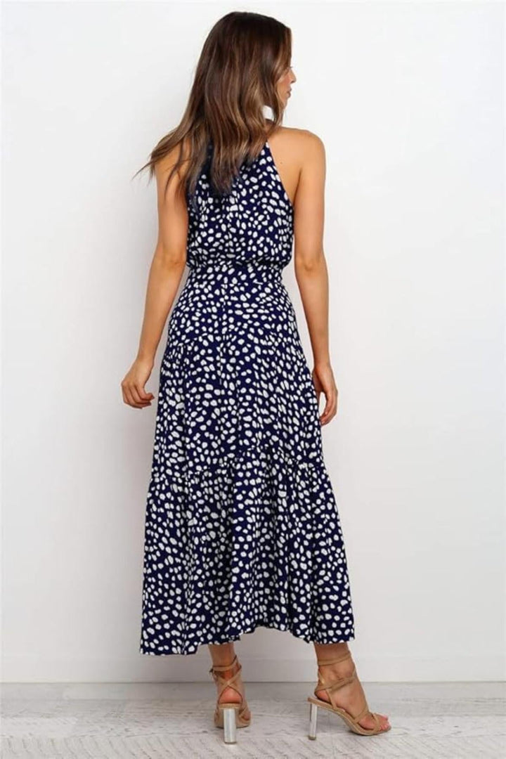 White polka dot halter midi summer dress. Women's casual elegant daytime wear with a stylish fit & flare design.