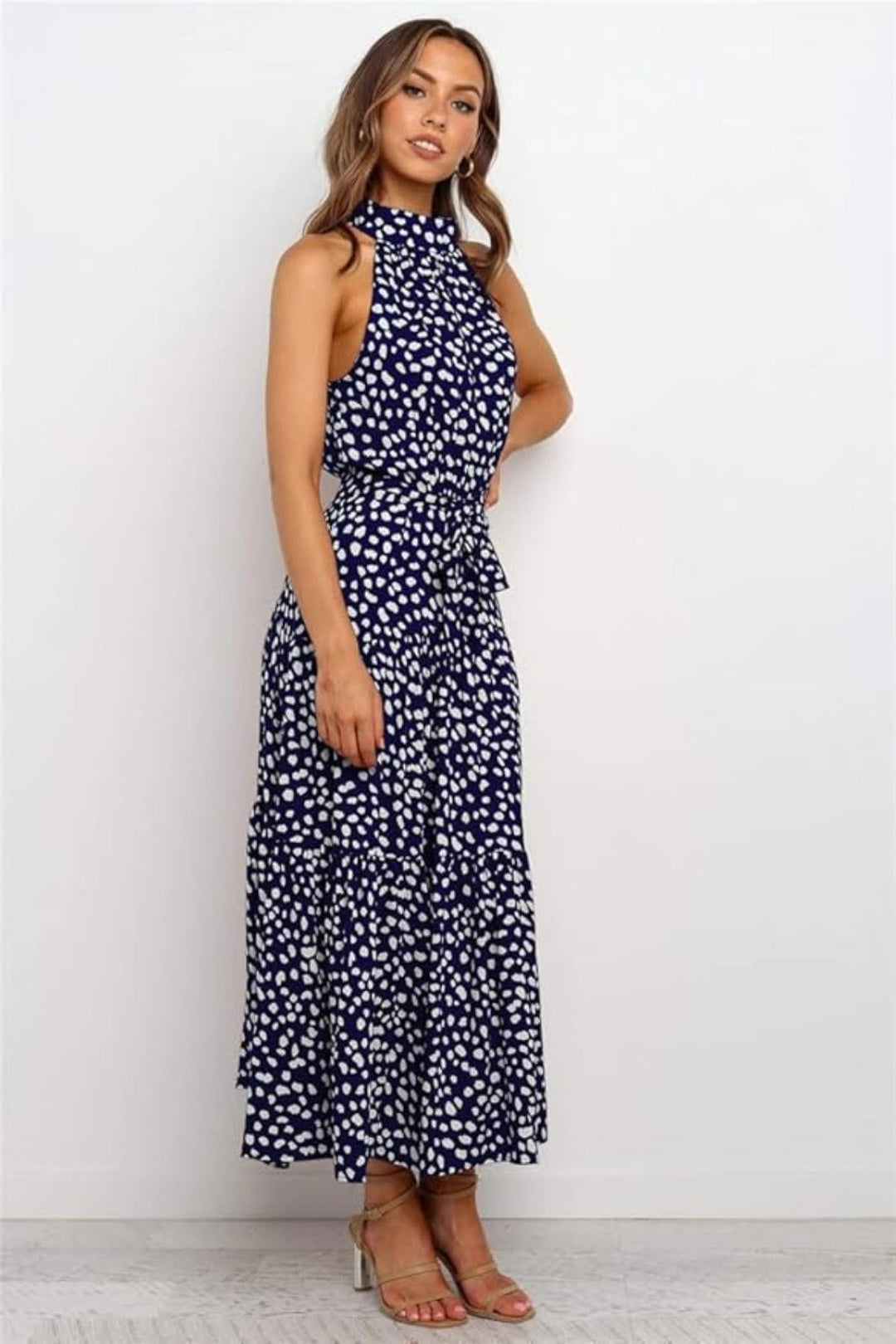 Elegant fit & flare polka dot halter midi dress for women. Perfect summer dress for casual or daytime wear.
