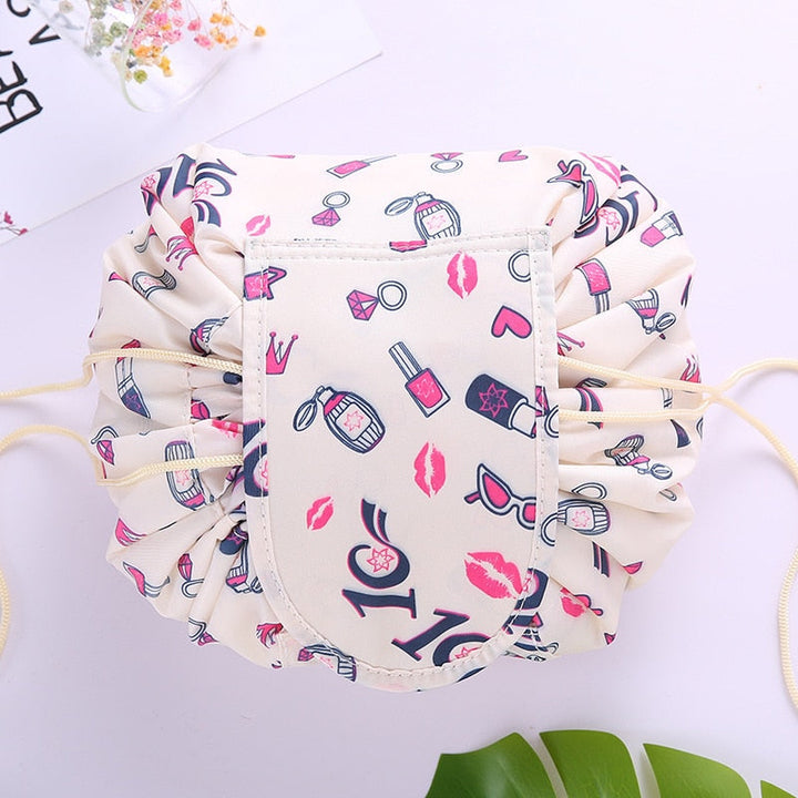 Stylish women's travel bag: drawstring design keeps cosmetics & toiletries neatly organized.