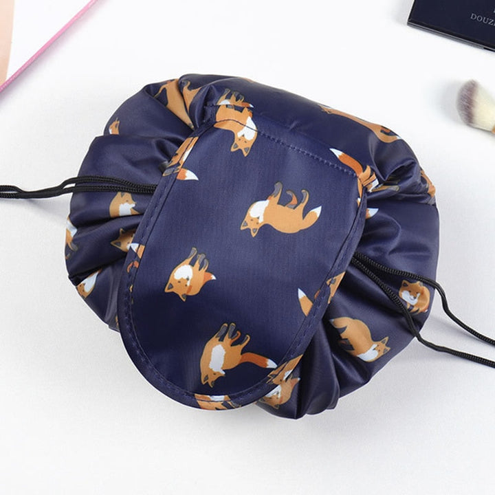 Closed, compact drawstring travel organizer for women's beauty essentials on the go.