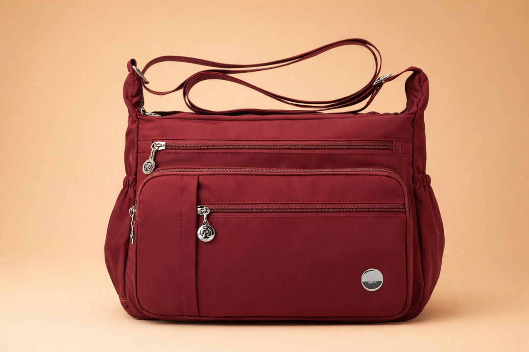 Secure women's red travel crossbody bag, perfect for everyday use. Features practical multi-pockets and sleek design.