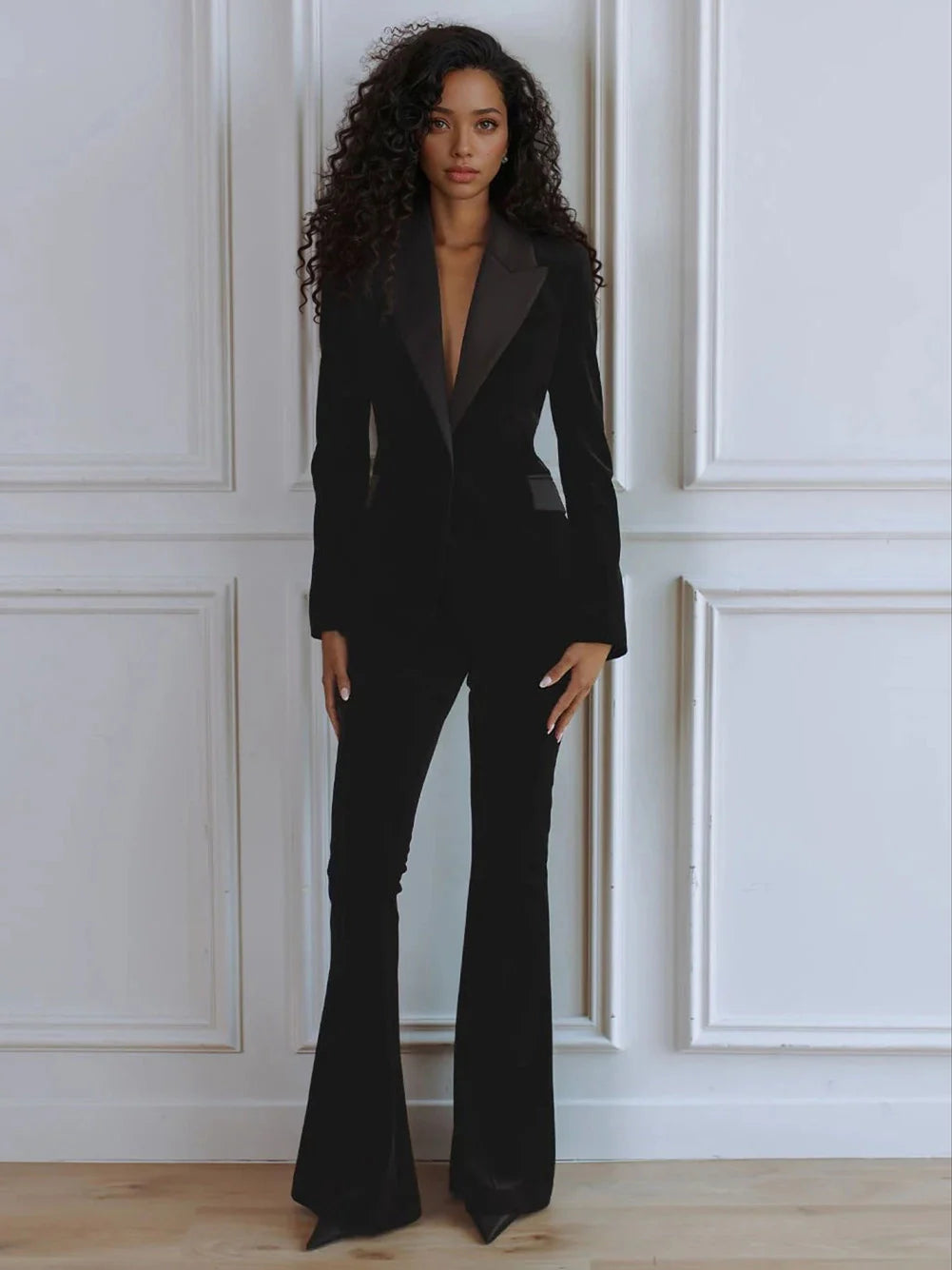 Stylish women's business attire: sleek blazer and comfortable flare trousers. A sophisticated workwear set.