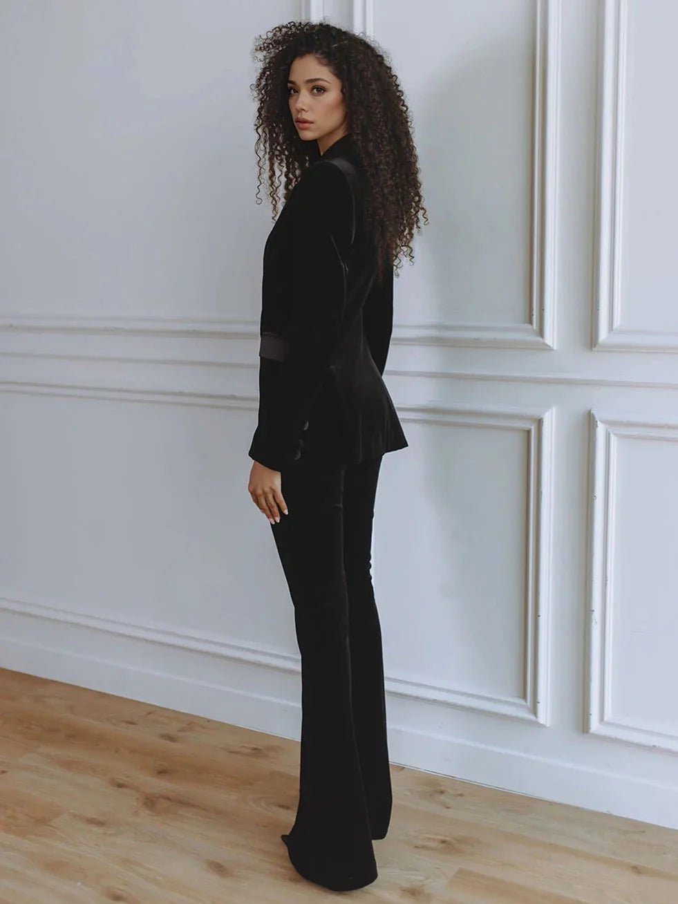 Women's elegant workwear ensemble: professional blazer and flattering flare trousers co-ord.