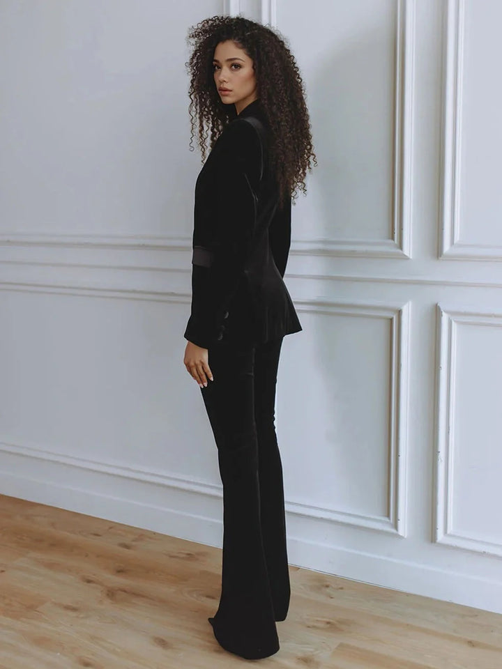 Women's elegant workwear ensemble: professional blazer and flattering flare trousers co-ord.