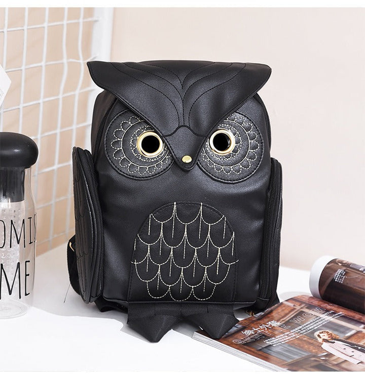 Women's PU leather owl print backpack, multi-pocket design for school or travel.