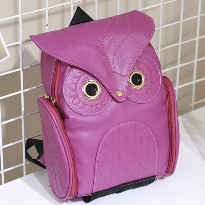 Chic women's animal print (owl) PU leather backpack with multiple pockets, a trendy accessory.