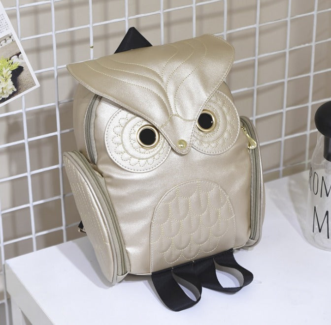 Fashionable PU leather owl print backpack for women, versatile multi-pocket school & travel bag.