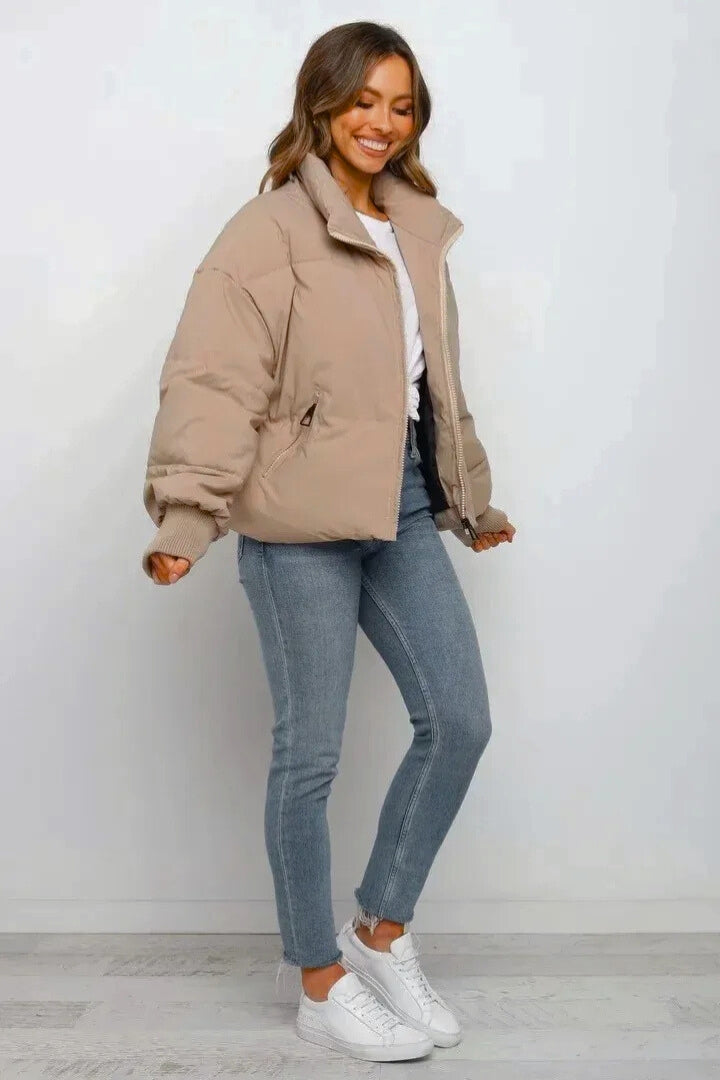 Zip-up women's short puffer jacket, quilted design for warmth, a trendy fall & winter fashion staple.