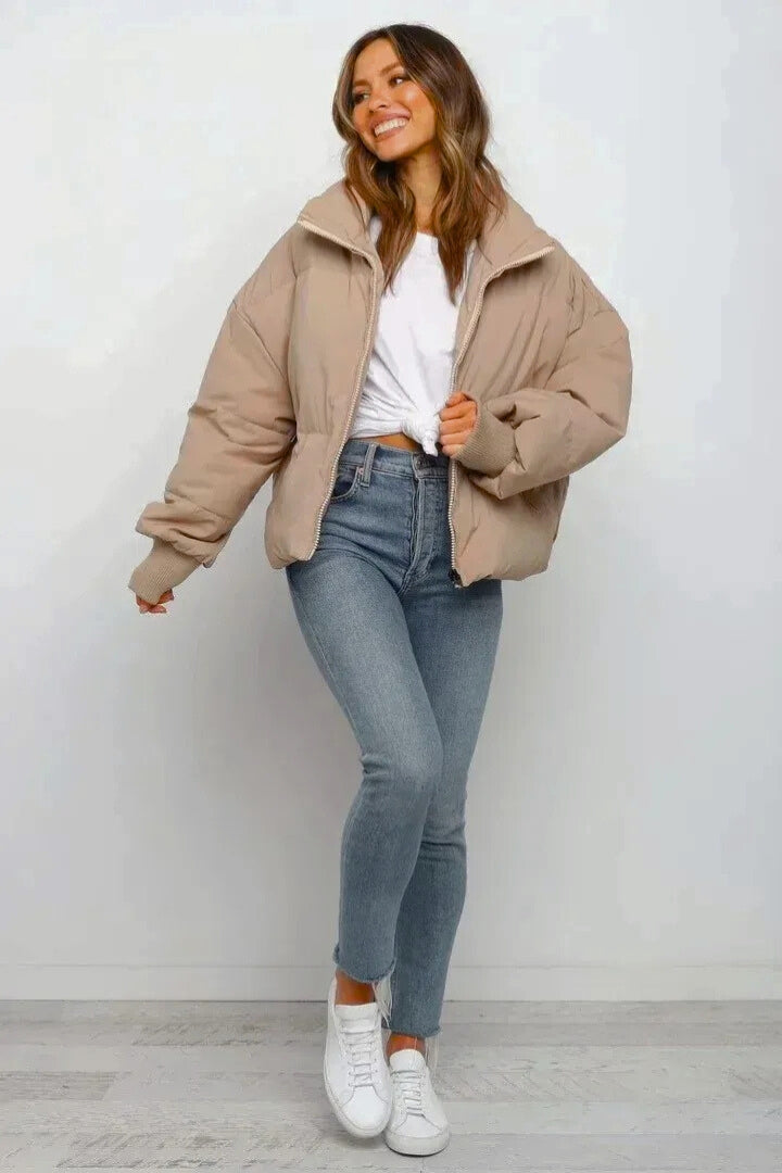 Quilted ladies puffer jacket, short & cropped, offers cozy warmth and chic style for casual fall fashion.