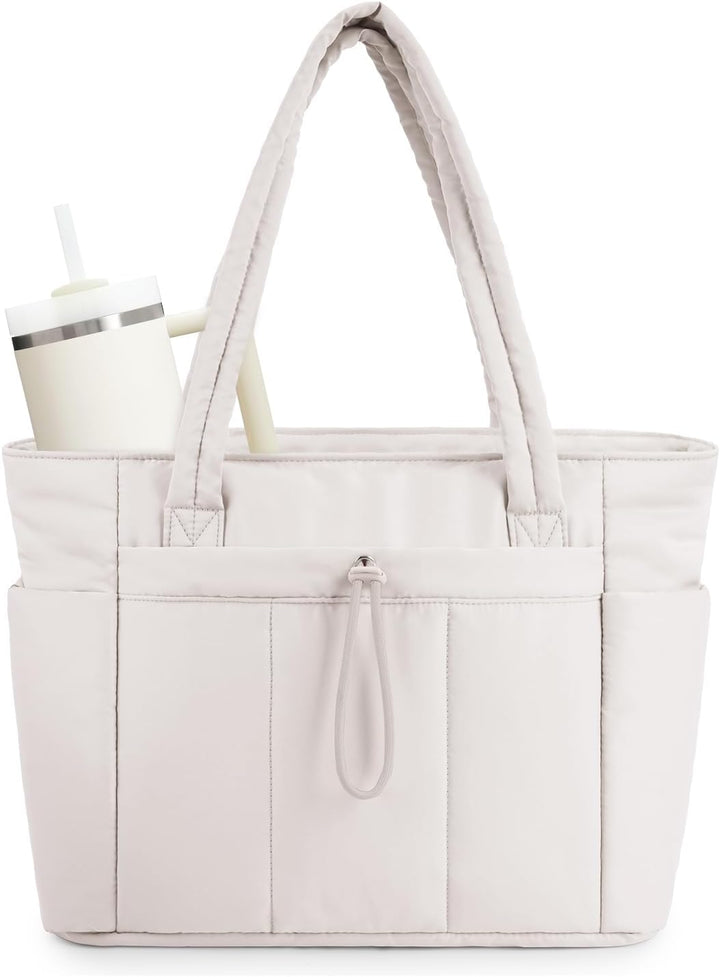Women's quilted puffer tote bag with laptop sleeve & cup holder for travel.