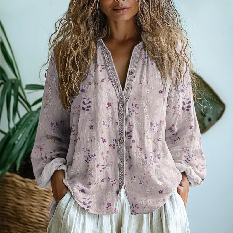Elegant women's blouse featuring a botanical nature print; relaxed fit for casual fashion.