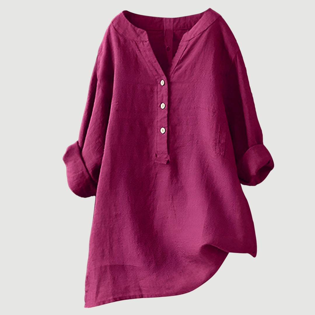 Women's button-front tunic with a relaxed fit. Long sleeve top, comfortable for casual elegant wear.