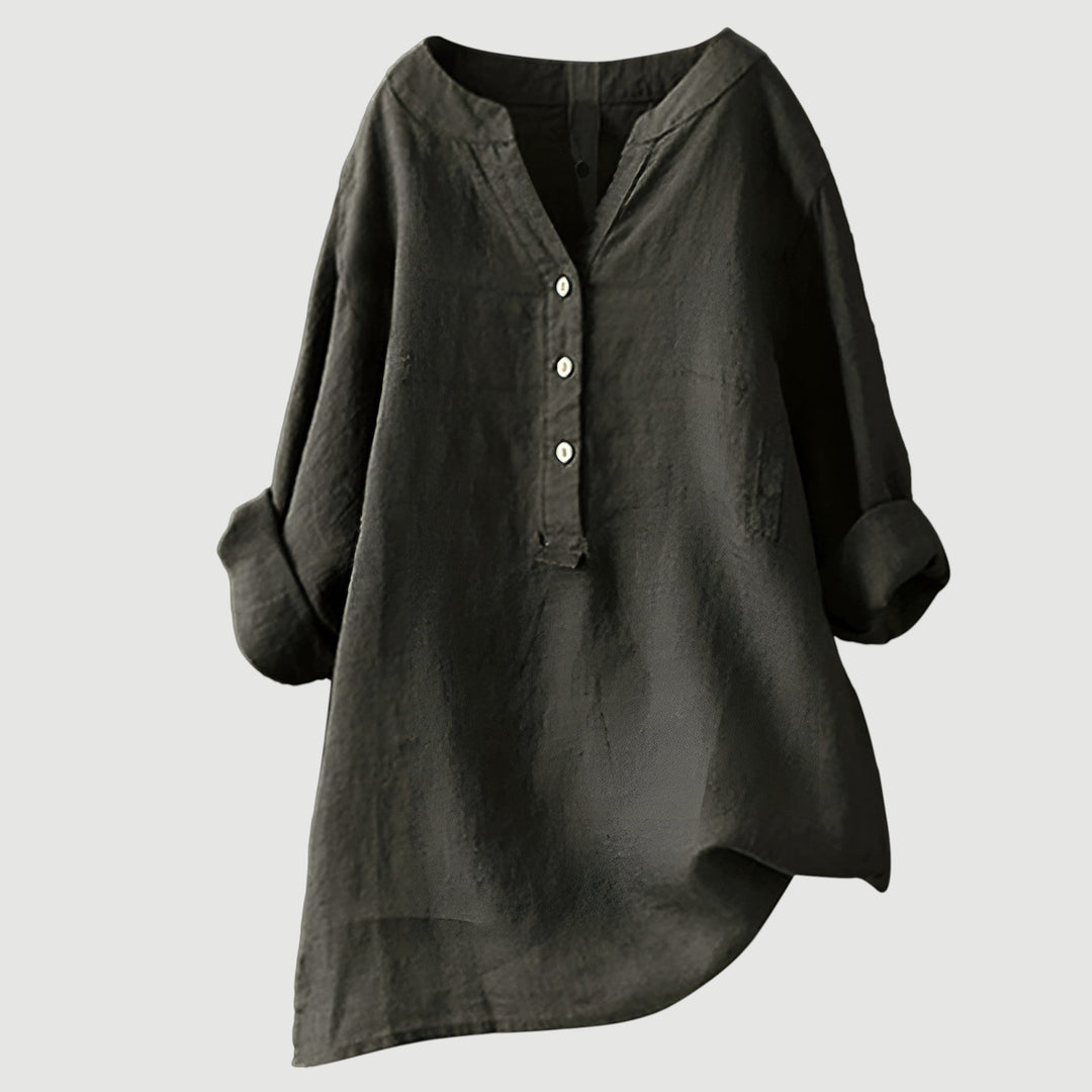 Plus size women's relaxed fit long sleeve button tunic. Comfortable, versatile, and elegant for everyday.