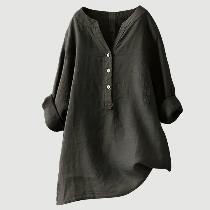 Plus size women's relaxed fit long sleeve button tunic. Comfortable, versatile, and elegant for everyday.