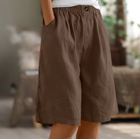 Close-up of comfortable women's relaxed fit shorts, showcasing soft fabric & flexible waist for summer.