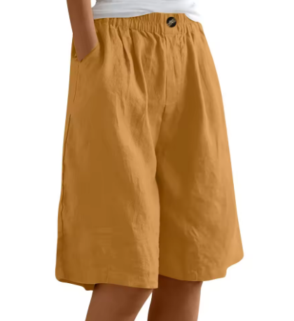 Woman in stylish relaxed fit comfort shorts, perfect for summer fashion, casual wear & chic outfits.