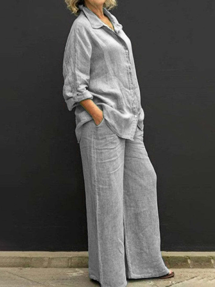 Woman wearing a stylish, relaxed fit cotton-linen two-piece summer suit set, perfect for a breezy vacation look.