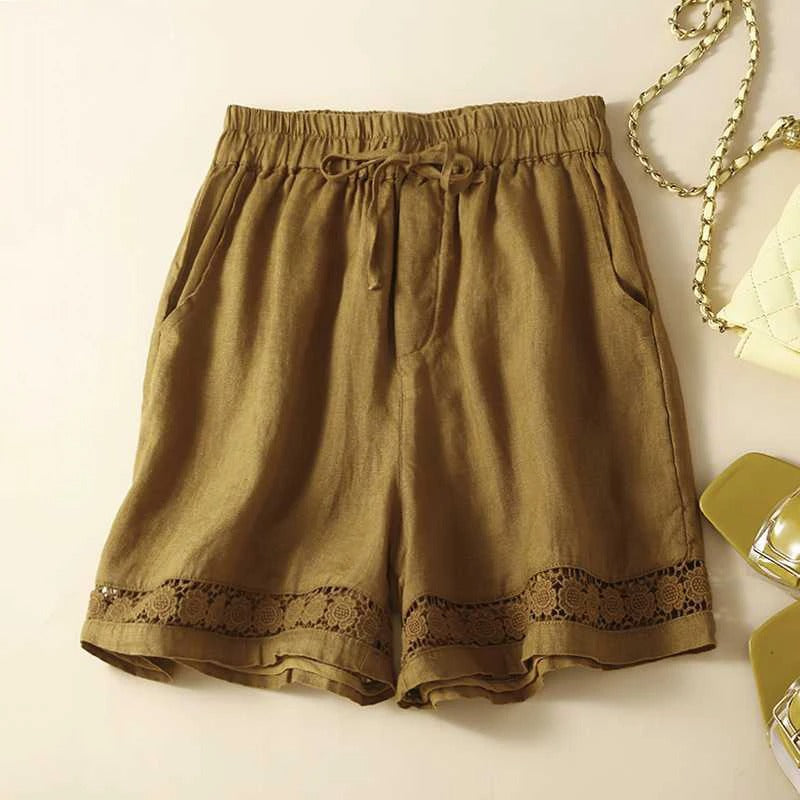 Comfortable white women's embroidered shorts with a relaxed fit, ideal for warm weather casual wear.