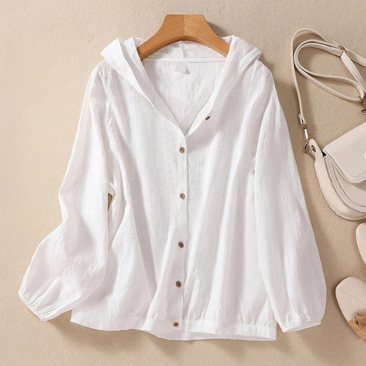 Women's relaxed fit hooded shirt in a soft fabric, perfect for casual everyday style and comfort.