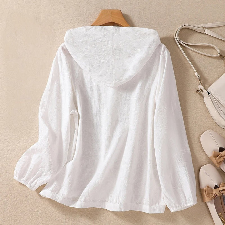 Soft women's relaxed hooded shirt, a comfortable long sleeve top designed for flattering casual everyday wear.