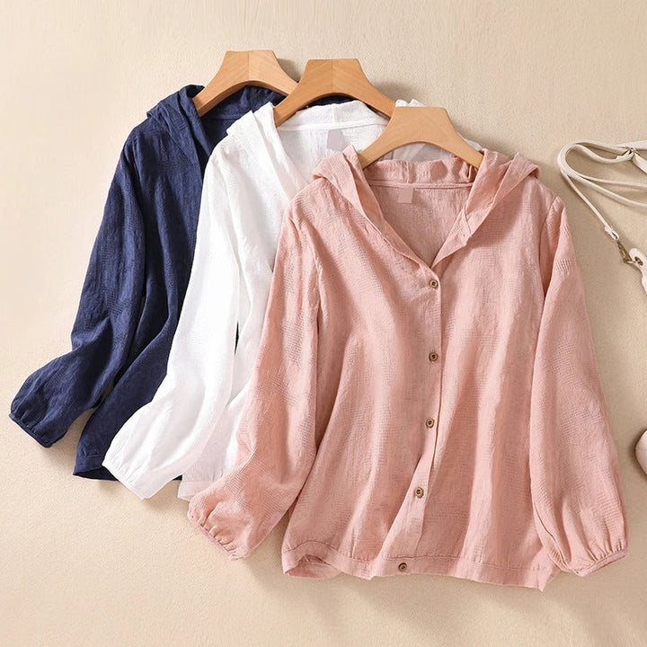 Stylish women's hooded shirt in a relaxed fit, a comfortable long sleeve top perfect for casual fashion.