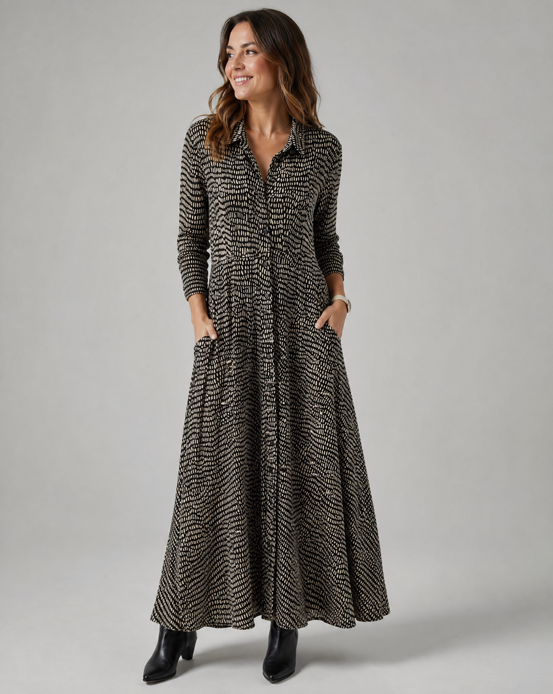 Women's relaxed fit maxi dress with V-neck, practical pockets, and stylish button-down front, perfect for casual wear.