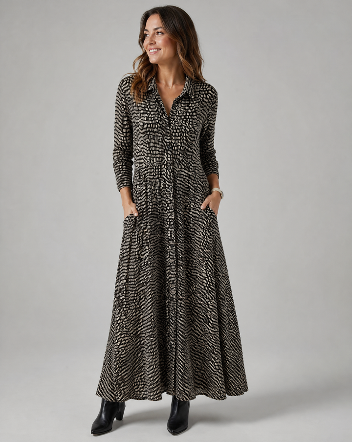 Women's relaxed fit maxi dress with V-neck, practical pockets, and stylish button-down front, perfect for casual wear.