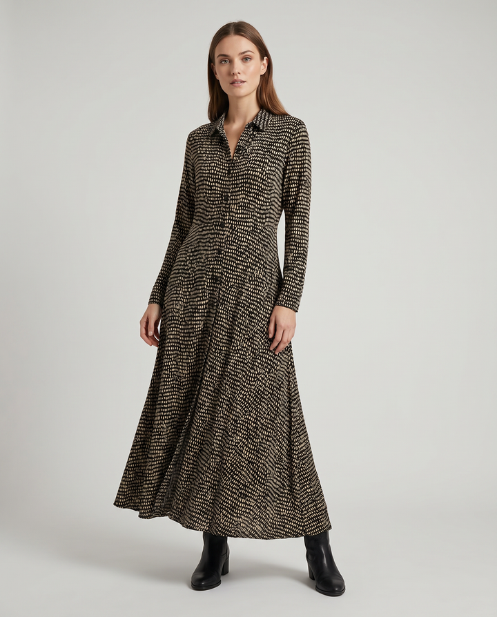 Stylish women's long maxi dress with a relaxed fit, elegant V-neckline, and functional side pockets for everyday wear.