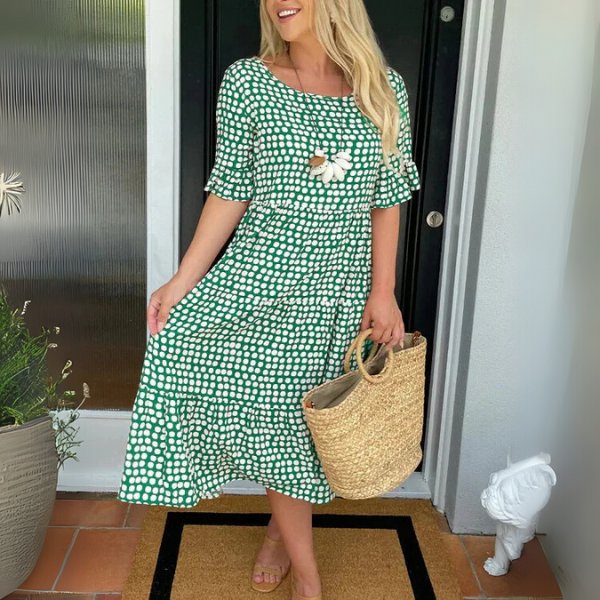 Lightweight women's tiered midi dress, ideal for summer style. Relaxed, comfortable, and flowy for casual everyday fashion.