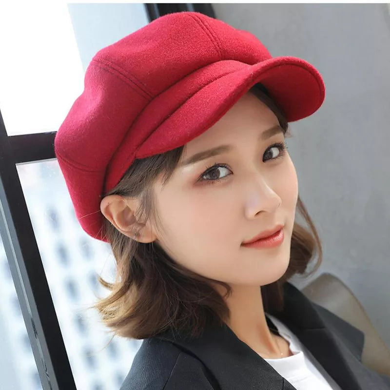 Red women's retro hat, stylish vintage balloon design. Warm cotton winter accessory.