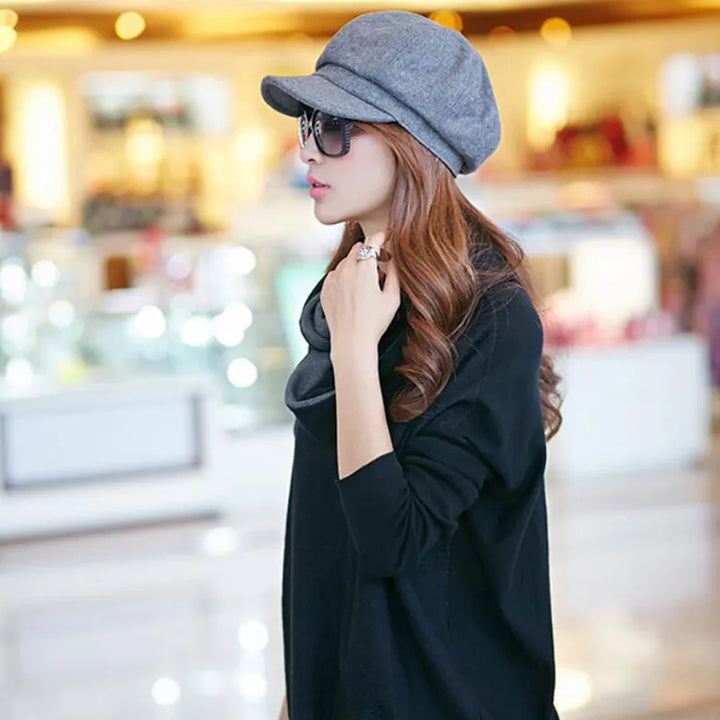 Vintage women's retro balloon hat for winter warmth. Stylish cotton fashion accessory.
