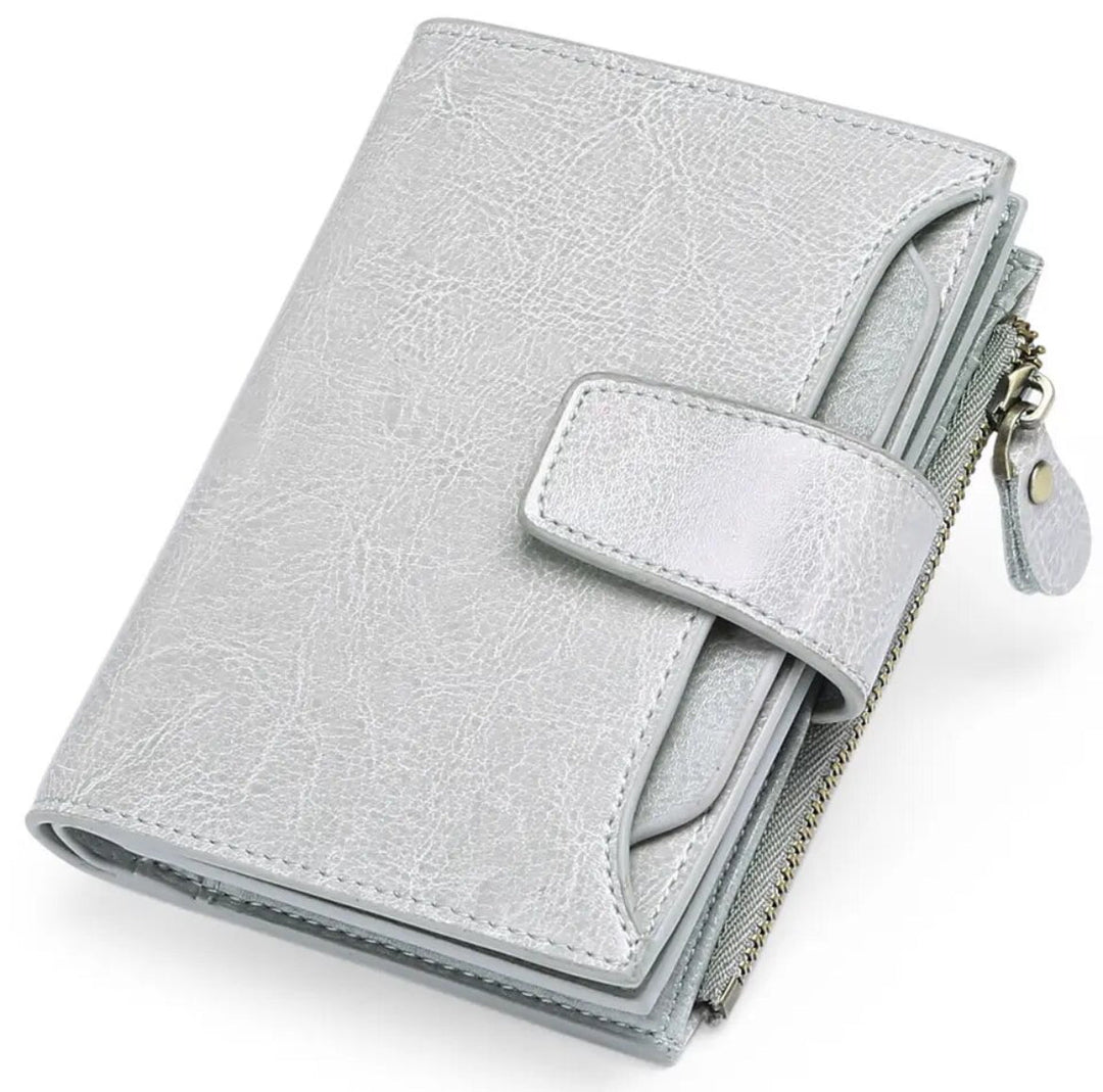 Travel-friendly women's RFID blocking leather wallet, secure storage for cards, cash, coins.