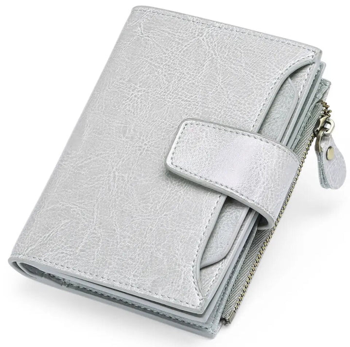 Travel-friendly women's RFID blocking leather wallet, secure storage for cards, cash, coins.