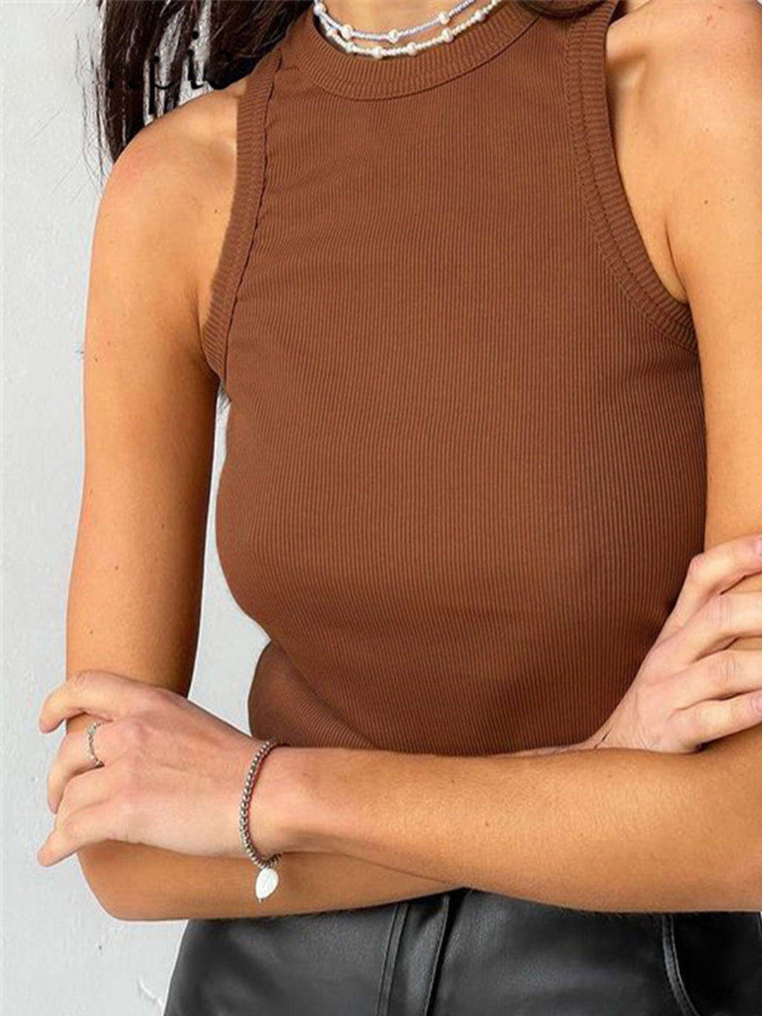 Effortless women's ribbed crop top, a fitted sleeveless tank for casual summer fashion.