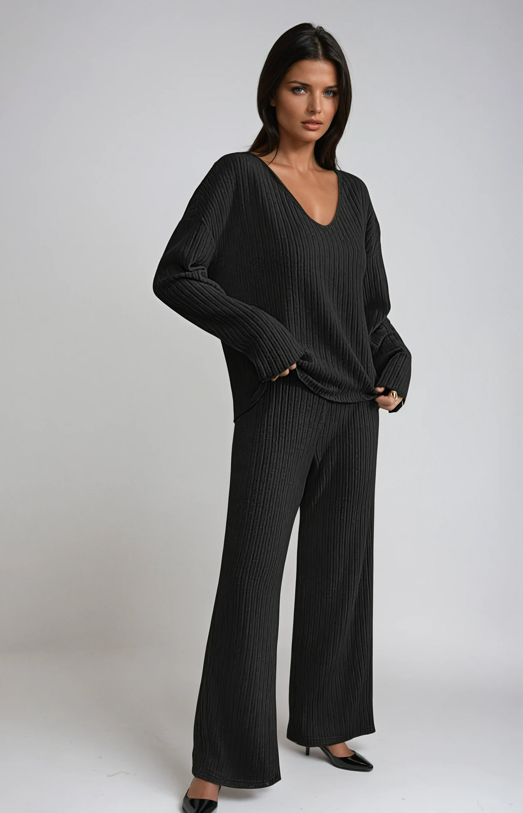 Women's ribbed knit lounge set, V-neck top & wide-leg pants for cozy comfort.